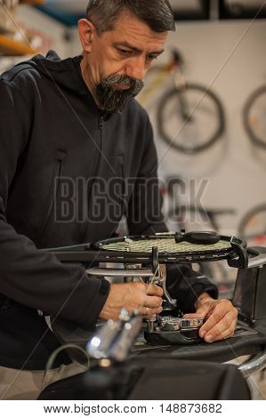 Tennis Stringer Doing Racket Stringing