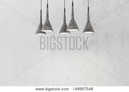 Industrial pendant lamps against rough wall, loft style