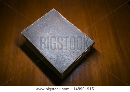 Old Book Resting on a Desk in a Library