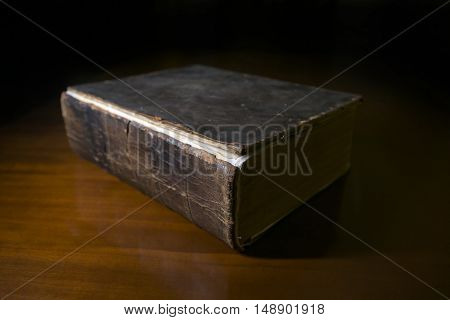 Old Book on Desk in a Library