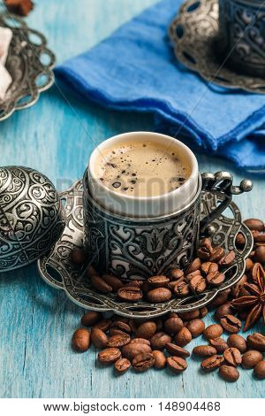 Turkish coffee and turkish delight with traditional embossed metal tray and cup
