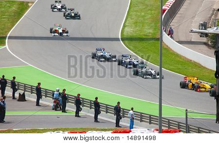 Racing cars on a circuit during The Formula 1 Grand Prix at autodrome 