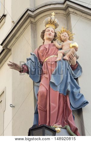 sculpture of Mary holding a baby, monument