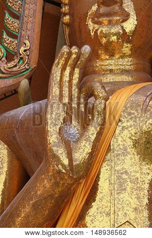 Gold Buddha statue (Luang por shin pa tan porn) in Thailand temple at Kanchanaburi temple (Wat Tham Sua).