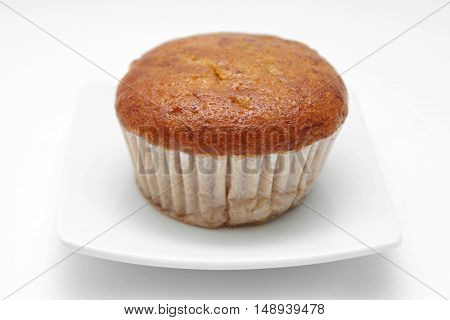 Banana cupcake with chololate on white plate