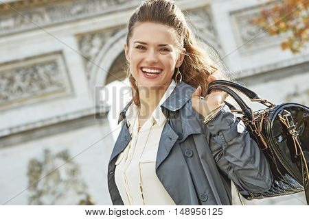 Smiling Elegant Woman Near Arc De Triomphe In Paris, France