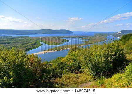 Panoramic view from the hill on the the Volga river near Samara city at sunny day. Beautiful natural landscape. Russia.