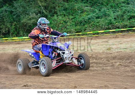 Unidentified Racer Rides A Quad Motorbike.
