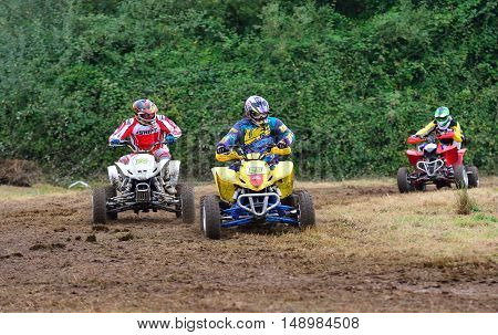 Unidentified Racer Rides A Quad Motorbike.