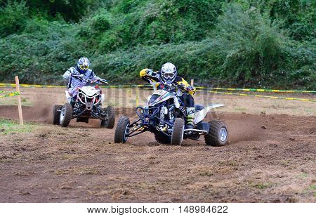 Unidentified Racer Rides A Quad Motorbike.