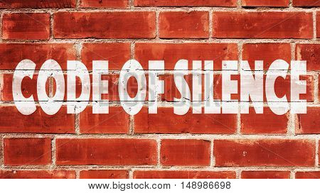 Code of silence Written On A Brick Wall.