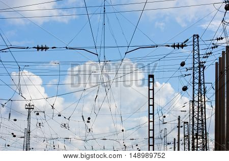 power line against the blue sky with white clouds at the railway station.Power Line against sky background.X-ray effect.