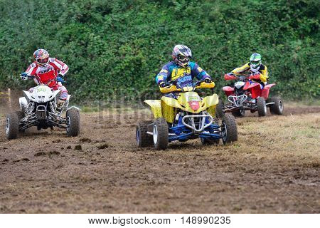 Unidentified Racer Rides A Quad Motorbike.