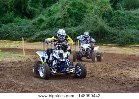 Unidentified Racer Rides A Quad Motorbike.