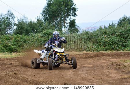Unidentified Racer Rides A Quad Motorbike.