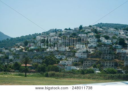Greek Building On The Mountain. White Houses