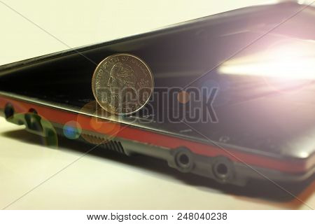Dollar Coin On The Laptop Keyboard. Internet Business And Online Money Concept, Toned