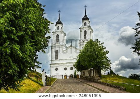 The Catholic Church In Ludza, Latvia In Summer Cloudy Day
