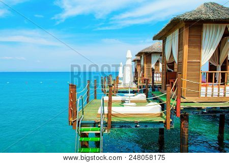 Wooden Beach Pavilions On The Shore Of A Sandy Beach - The Mediterranean Coast, Beldibi, Antalya, Tu