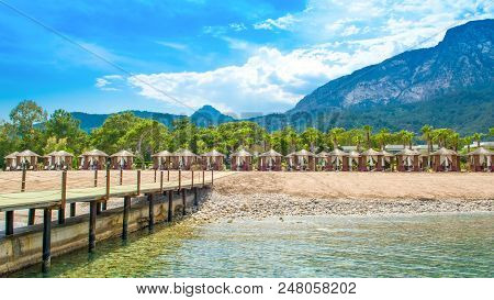 Wooden Beach Pavilions On The Shore Of A Sandy Beach - The Mediterranean Coast, Beldibi, Antalya, Tu