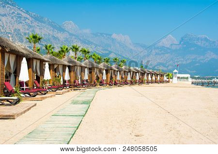 Wooden Beach Pavilions On The Shore Of A Sandy Beach - The Mediterranean Coast, Beldibi, Antalya, Tu
