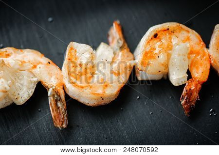 Close Up Food Photo Of Fried Shrimps On Black Slate Background. Asian Culture And Cuisine. Food Imag