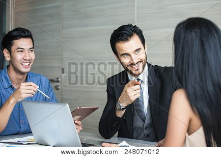 Man Discussing With Woman For Project With Attractive Smiling  At Office. Businessman With Happy Emo