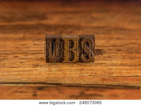 Vbs For Vacation Bible School Spelled In Block Letters On A Wooden Table