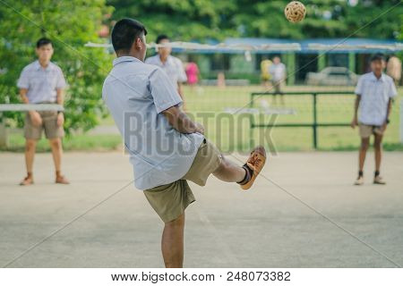 Happiness Students Play Sepak Takraw In The Afternoon.