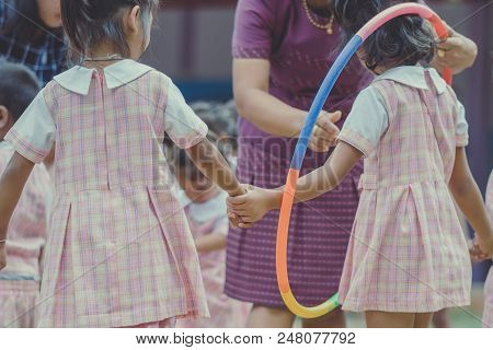 Young Kids Exercise With Hoola Hoop In The Morning.