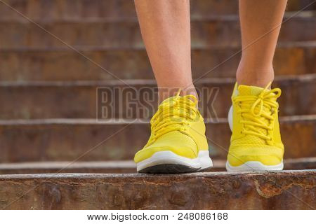Close-up Of Man's Running Shoes While Walking Towards The Camera.