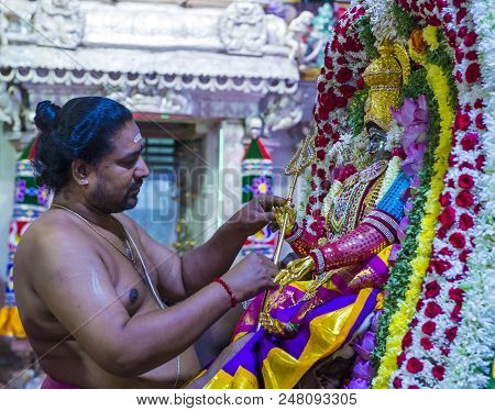 Singapore - Feb 24 : Indian Man Decorating Idol In Sri Veeramakaliamman Temple In Little India, Sing