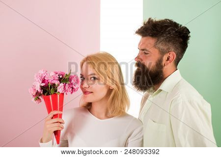 Woman Enjoy Fragrance Bouquet Flowers. Couple In Love Happy Celebrate Anniversary. Man With Beard Ta
