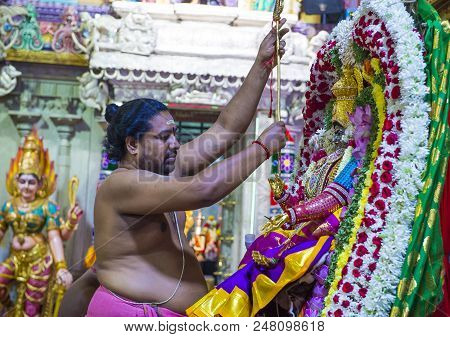Singapore - Feb 24 : Indian Man Decorating Idol In Sri Veeramakaliamman Temple In Little India, Sing