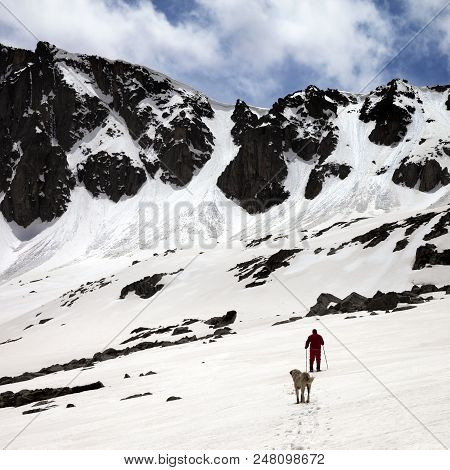 Hiker And Dog In Snowy Mountains. Turkey, Kachkar Mountains, Highest Part Of Pontic Mountains.