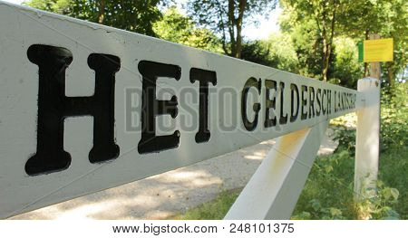 Schaarsbergen, The Netherlands - July 1, 2018: White Wooden Gate Of Dutch Nature Organization Het Ge