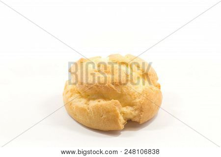 One Round Yummy Profiterole Isolated On A White Background.