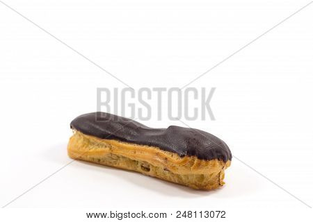 One Long Yummy Eclair With Chocolate Isolated On A White Background.