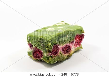 Delicsious Fresh Pistachio Pastry Sliced Piece Of Cake With Candied Cranberries.
