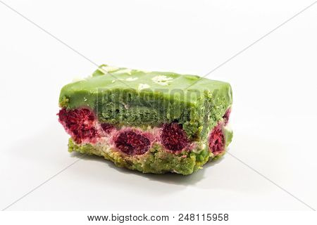 Delicsious Fresh Pistachio Pastry Sliced Piece Of Cake With Candied Cranberries.