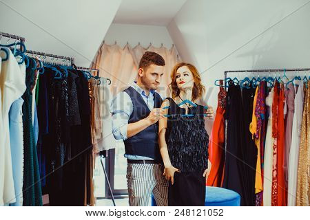 Couple Of Beautiful Actors Both With A Bright Makeup, Standing In Their Changing Room, Deciding Abou