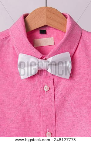White Bow Tie Pink Shrits On White Background