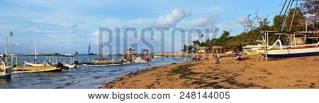 Bali, Indonesia - May 29, 2018; Colorful Early Morning Bali Fishing Boats And People Panorama On San