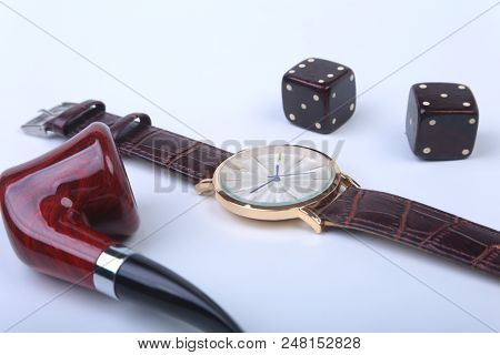 Men's Accessories For Business And Rekreation. Watch, Smoking Pipe And Dice On White Background.. To