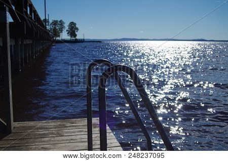A Ladder To Step Into The Water Of Lake Siljan In Dalarna