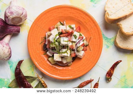 Greek salad with feta cheese cubes and fresk vegetables