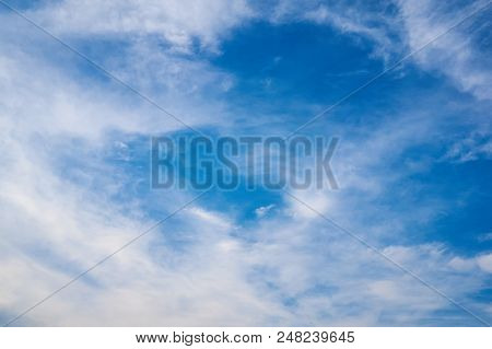Beautiful Blue Sky With Fleecy Clouds. Abstract Background.
