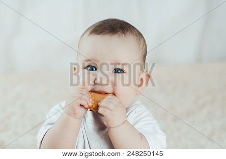 Adorable Baby Eating A Cookie