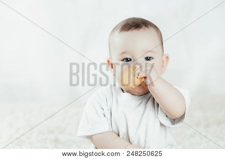Adorable Baby Eating A Cookie