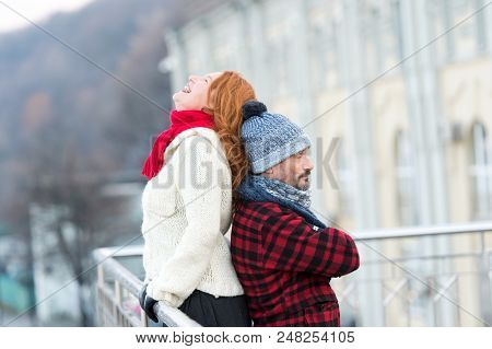 Funny Couple Back To Back. Smiling Woman Leans To Guy Back. Happy Girl Leans To Men. Men Hold Woman 